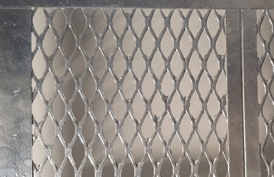 Close-up view of hot-dipped galvanised mesh partition panels, making them rust-resistant